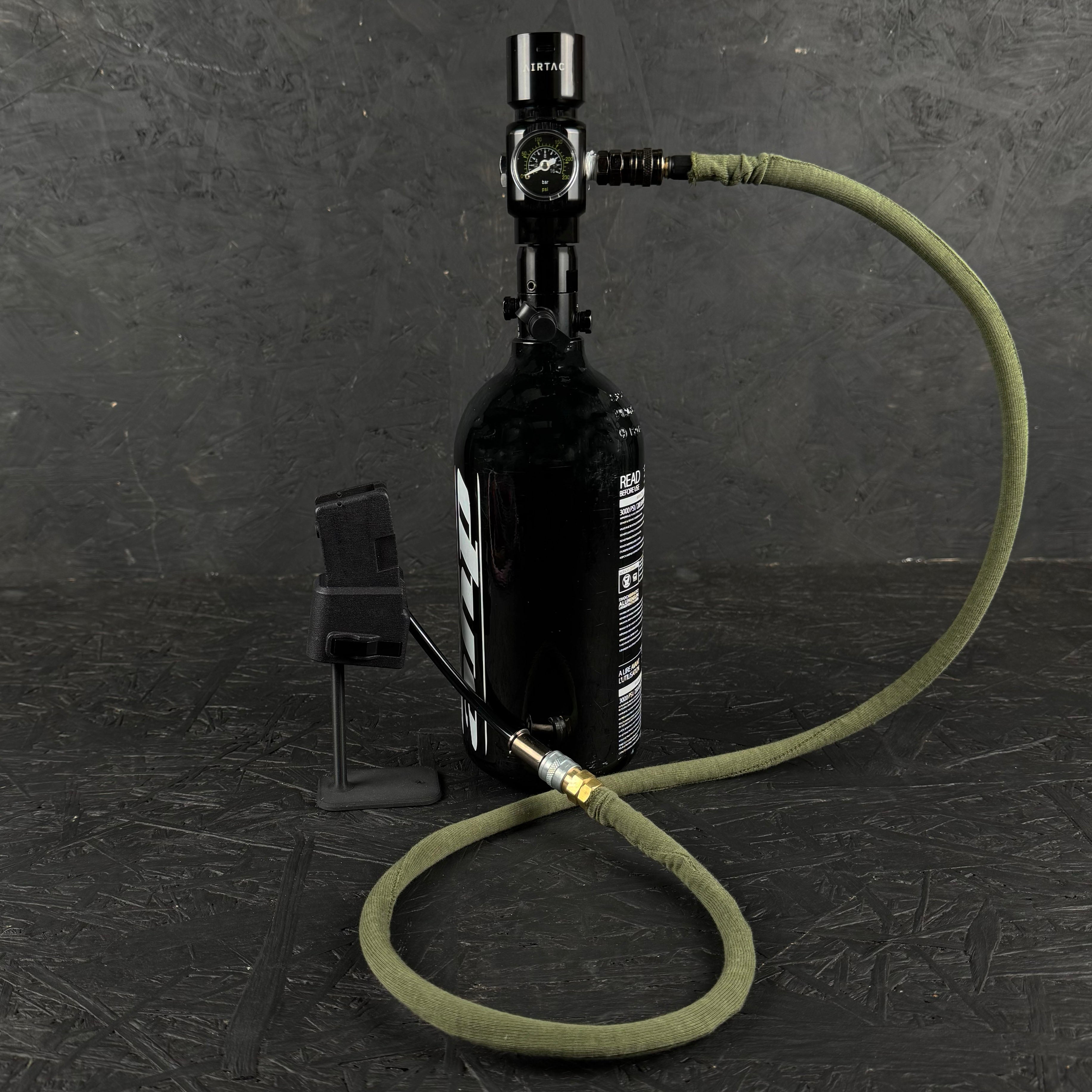 Photo of green Airtac Line Cover attached to adapter and reg