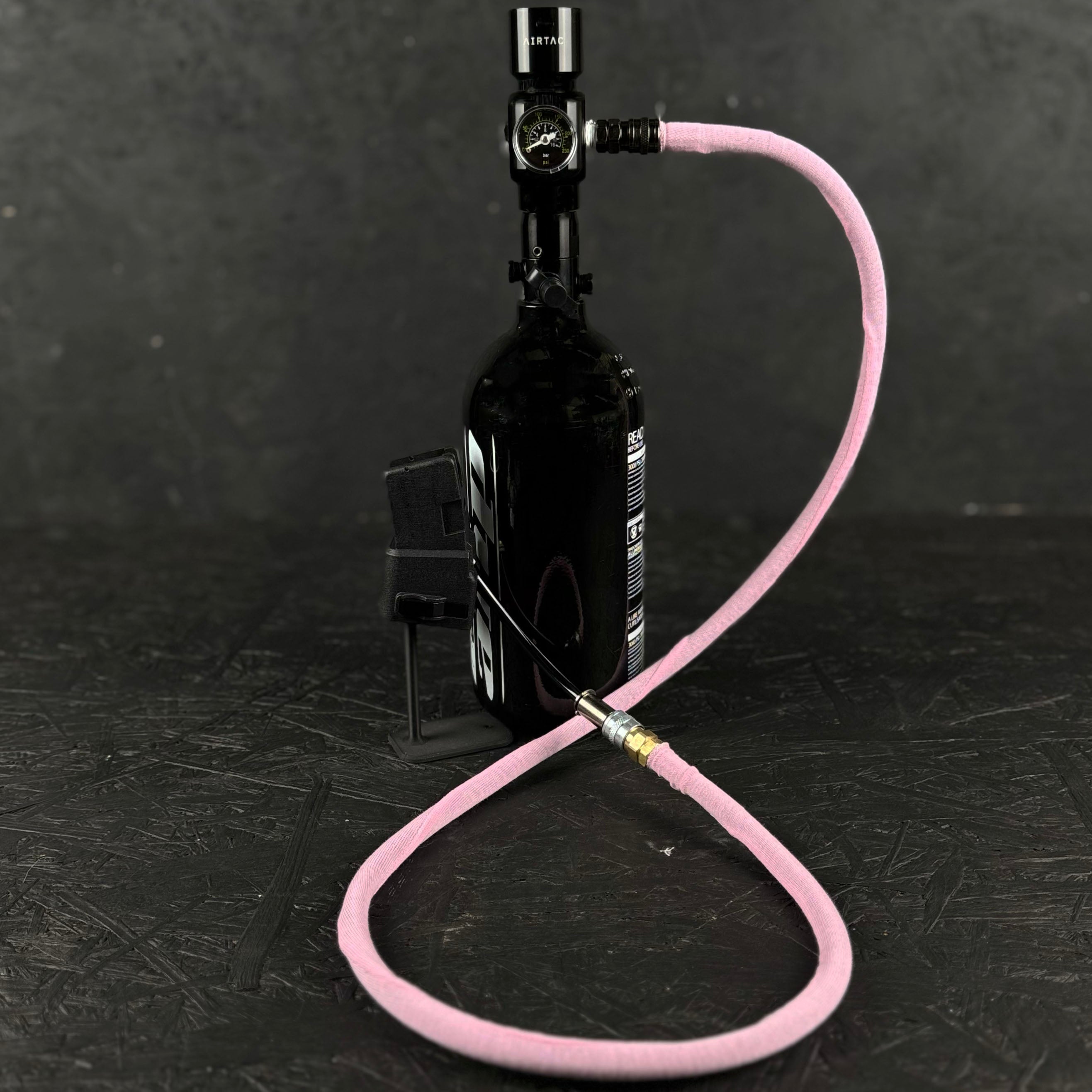 Photo of pink Airtac Line Cover attached to adapter and reg