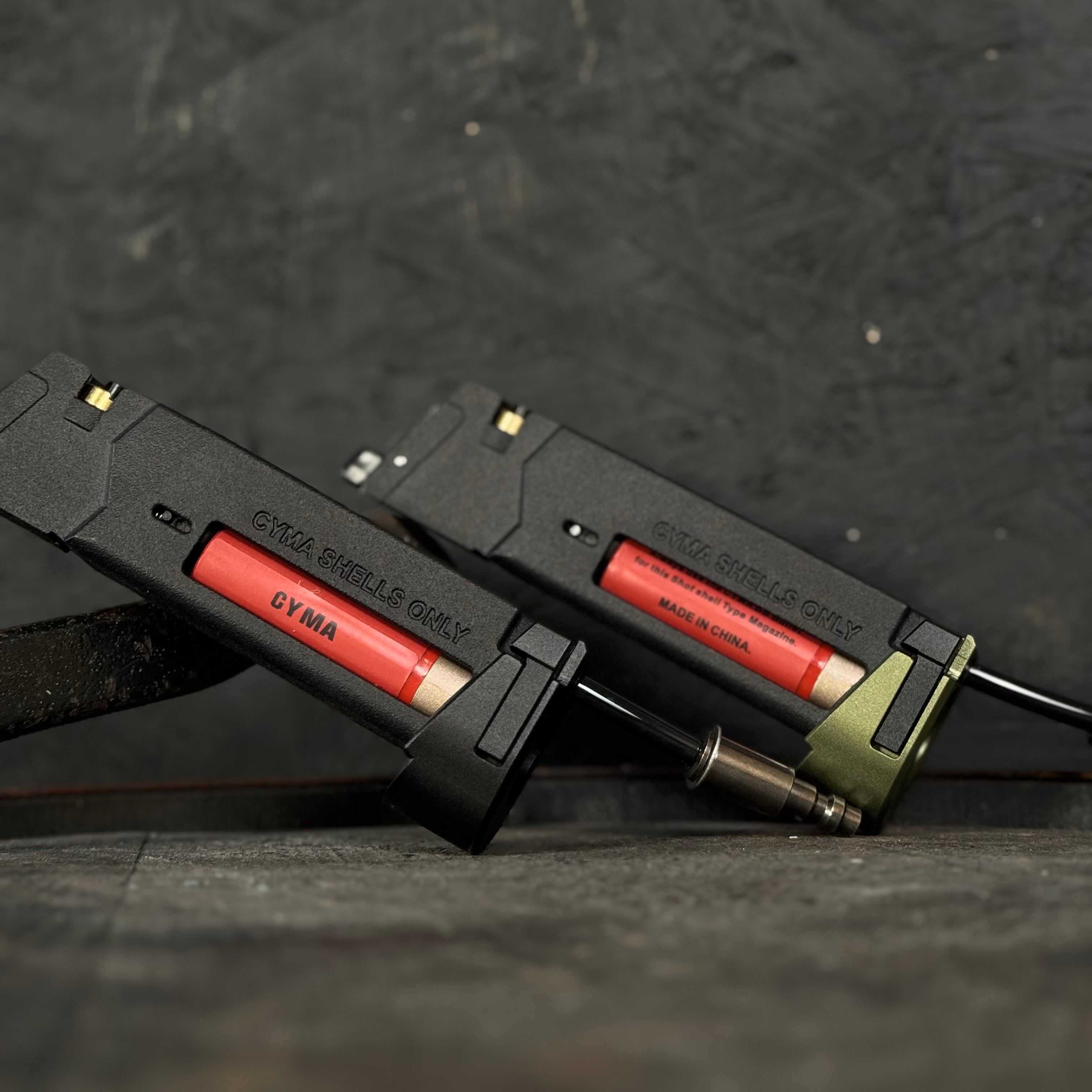 Photo of two AIRTAC X T1P MK23/SSX303/SSX23 Shotgun Shell HPA Adapters. One with a black base and one with a green base