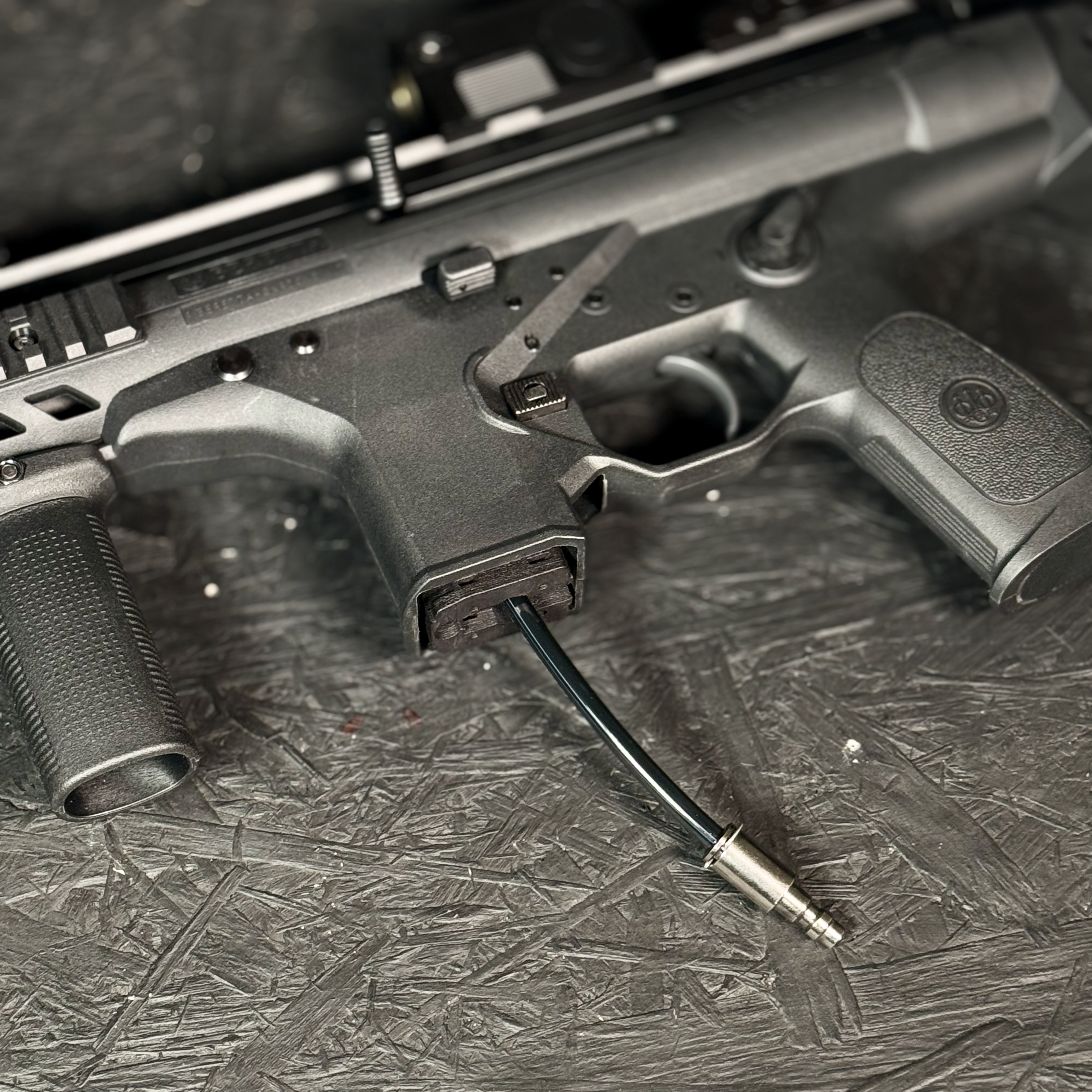 Close up photo of AIRTAC Beretta PMX Modular HPA Adapter in RIF