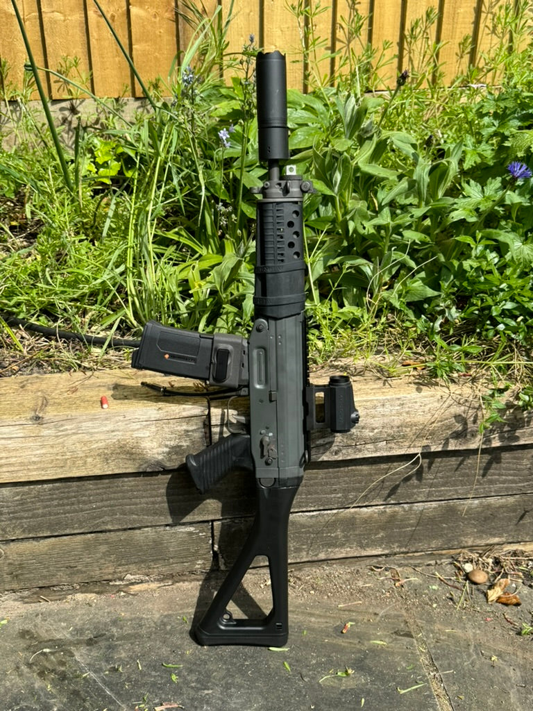 Photo of AIRTAC GHK 553 HPA Adapter (Modular) - PLUG AND PLAY in RIF with M4 base and magazine. RIF is stood on its stock.