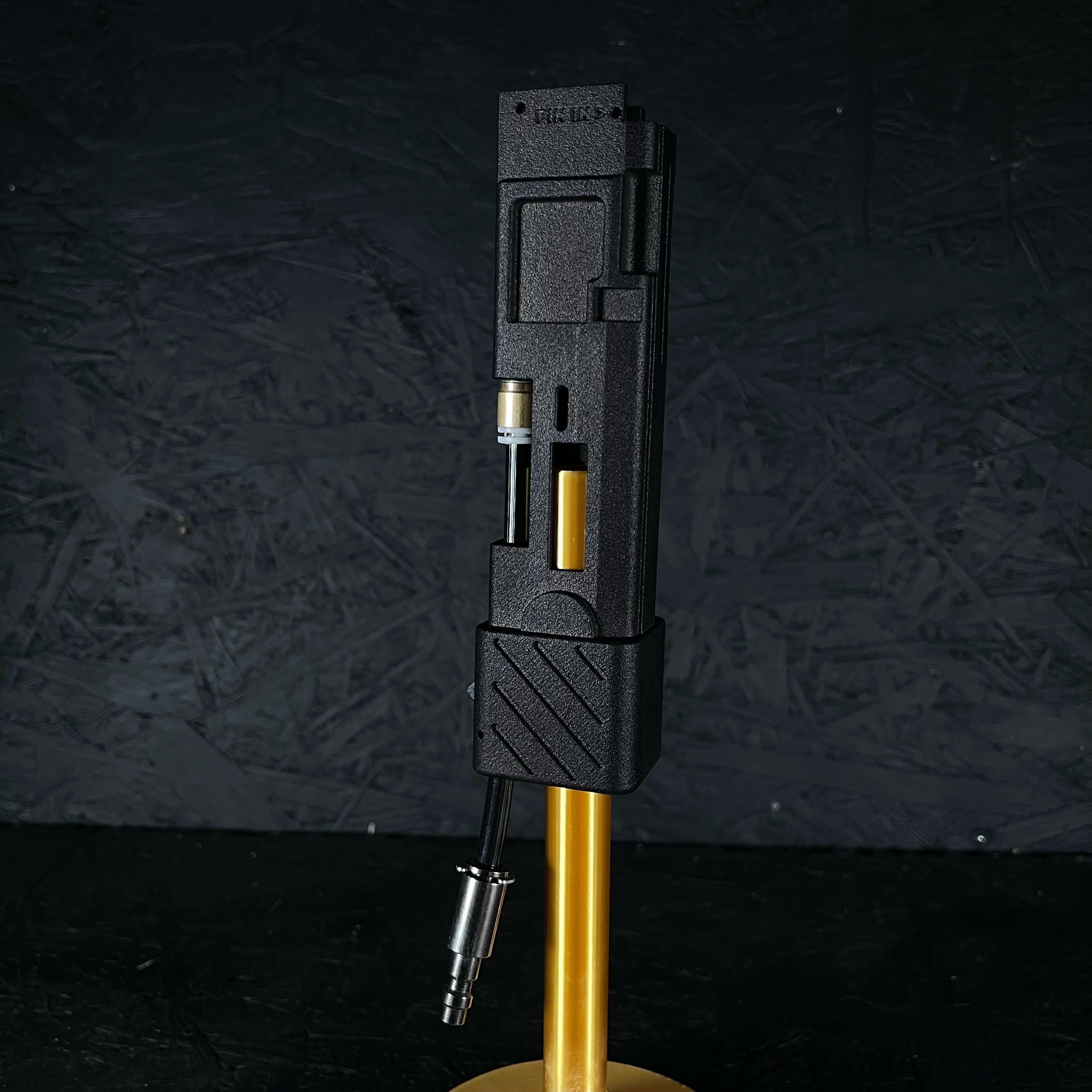 Photo of AIRTAC KWA/KSC MP9/Beretta PMX Shotgun Shell HPA Adapter on gold stand