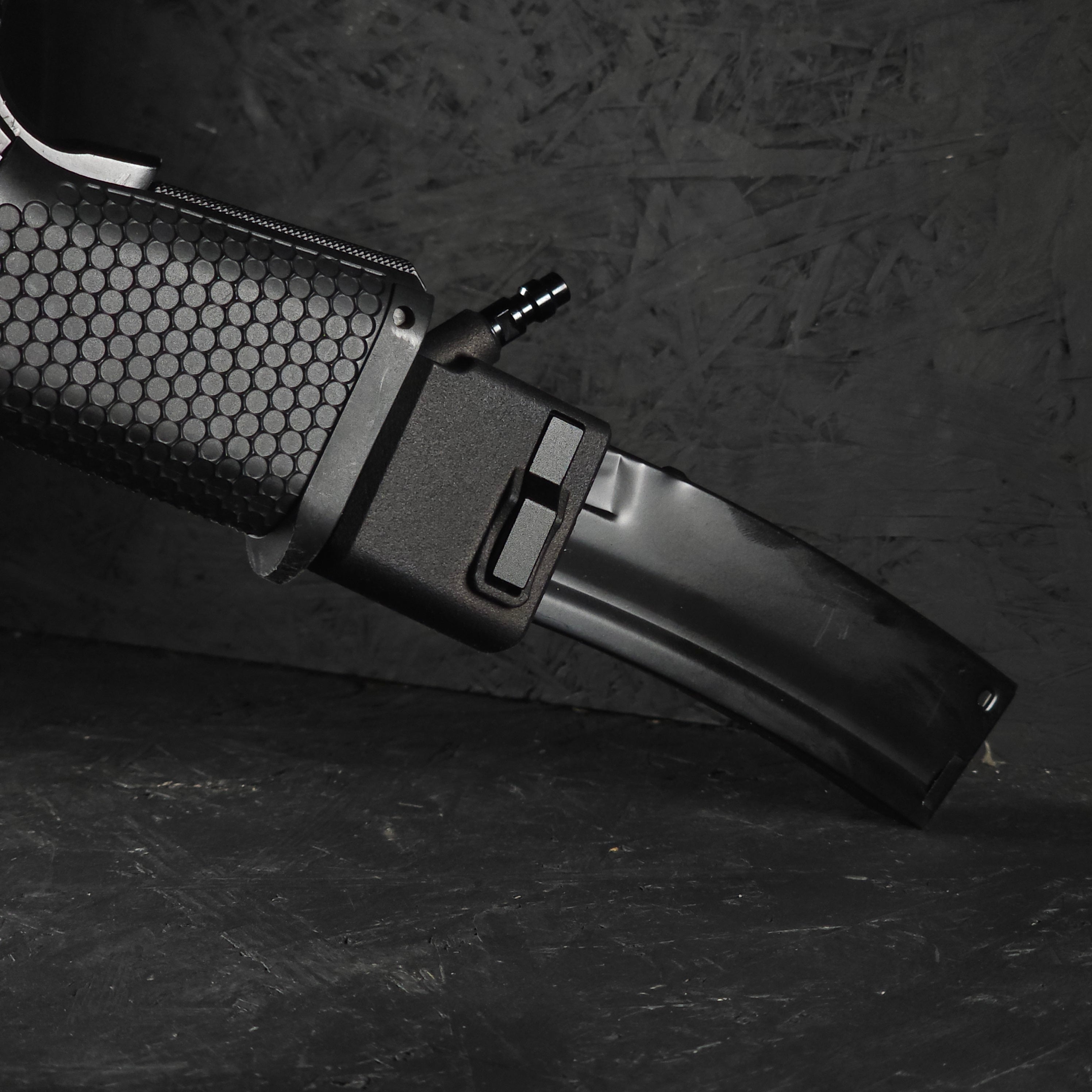 Close up photo of AIRTAC TM/WE Hi-Capa/Novritsch SSP1 SSP5 to MP5 HPA Adapter in RIF with short mag