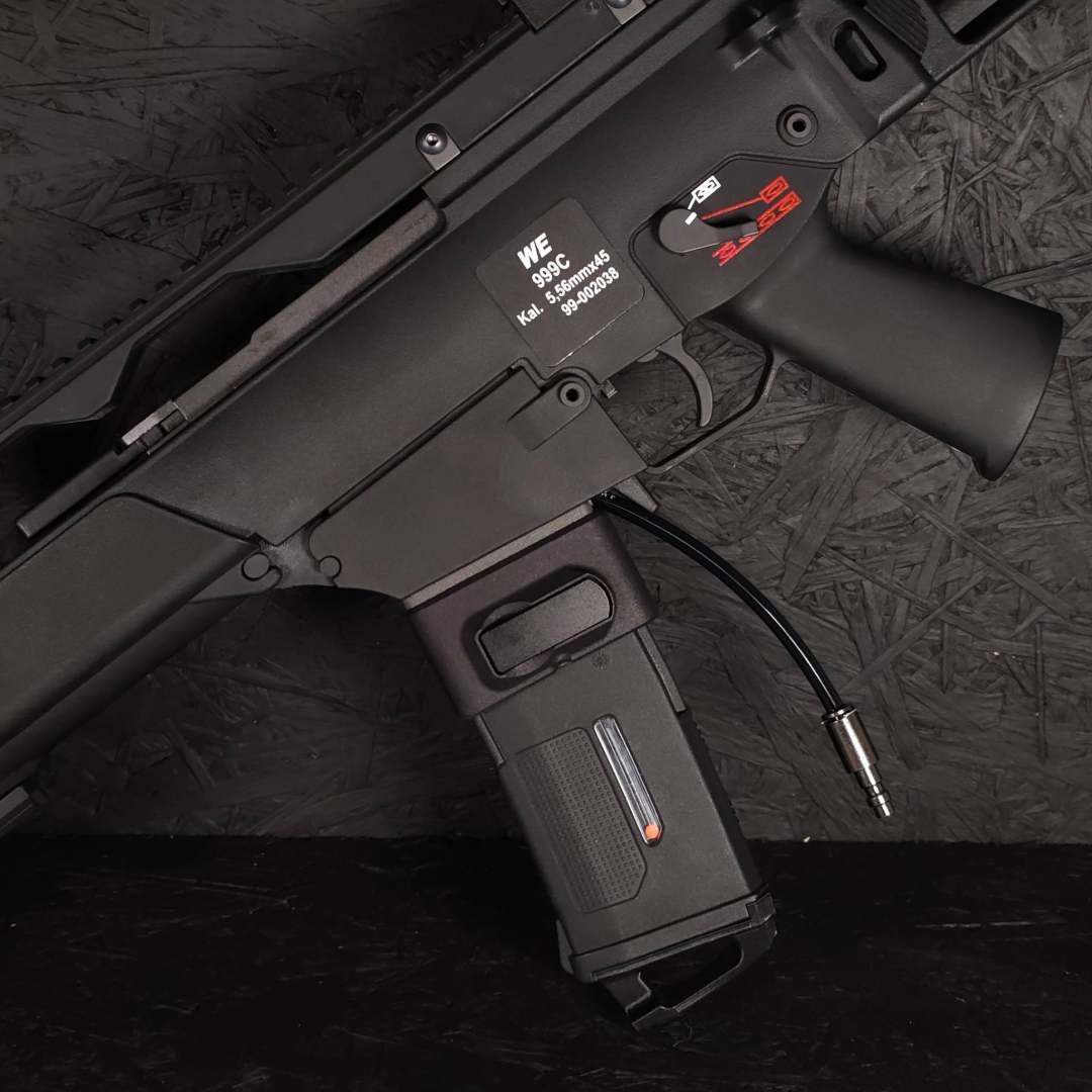 Close up photo of AIRTAC WE G36C to M4 HPA Adapter in RIF with magazine