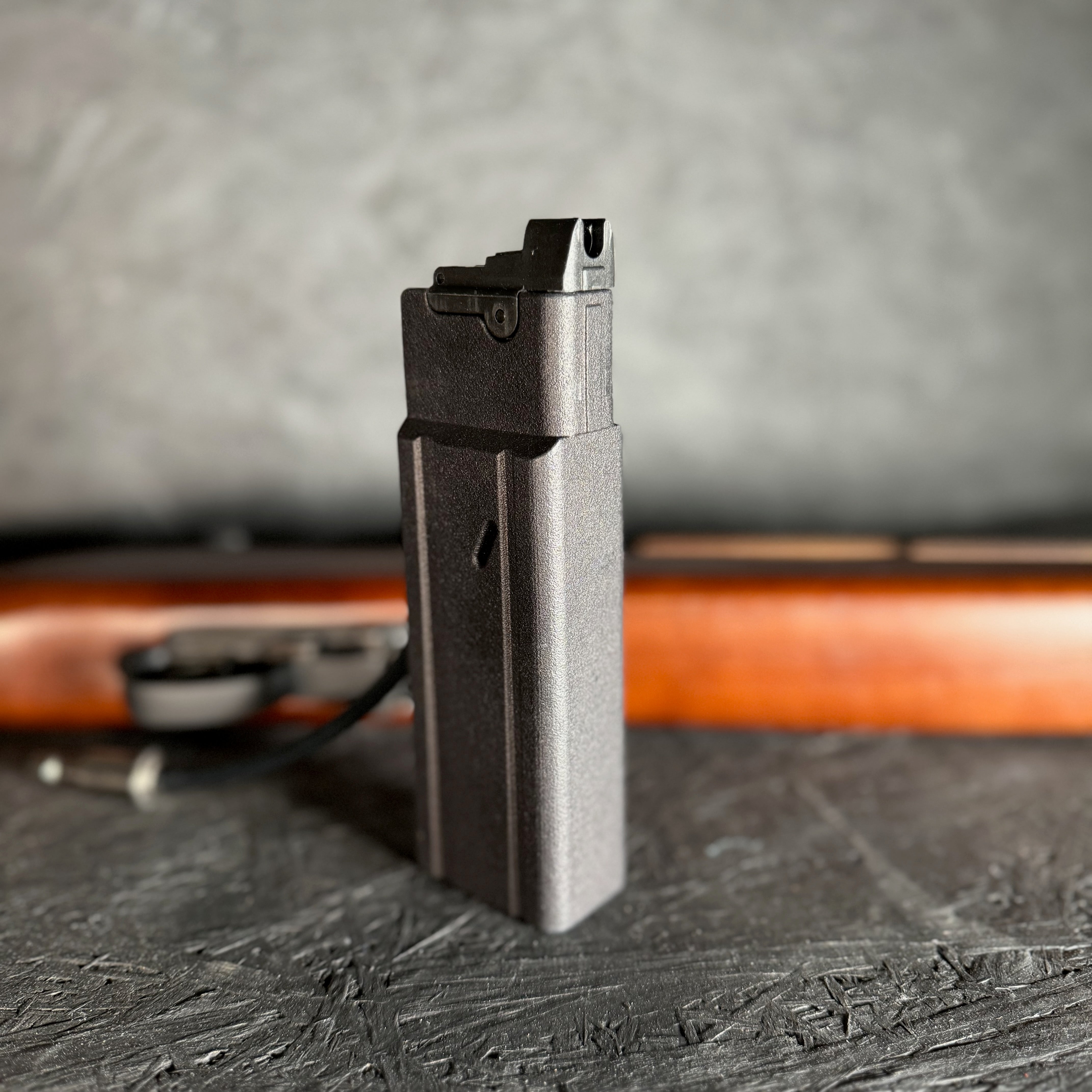 Photo of AIRTAC King Arms M1/M2 Carbine Shotgun Shell HPA Adapter with RIF laying down in the background