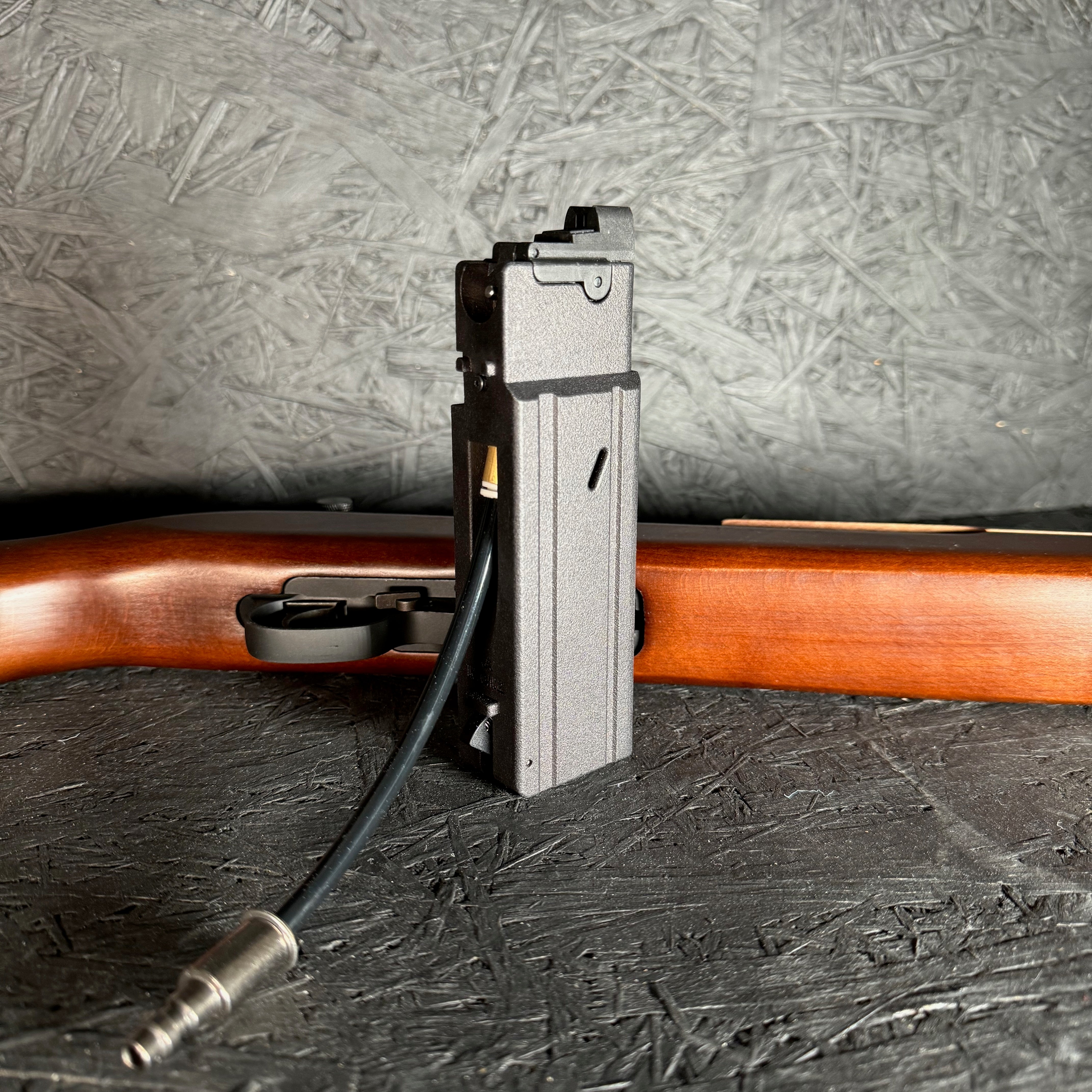 Photo of AIRTAC King Arms M1/M2 Carbine Shotgun Shell HPA Adapter with RIF laying down in the background