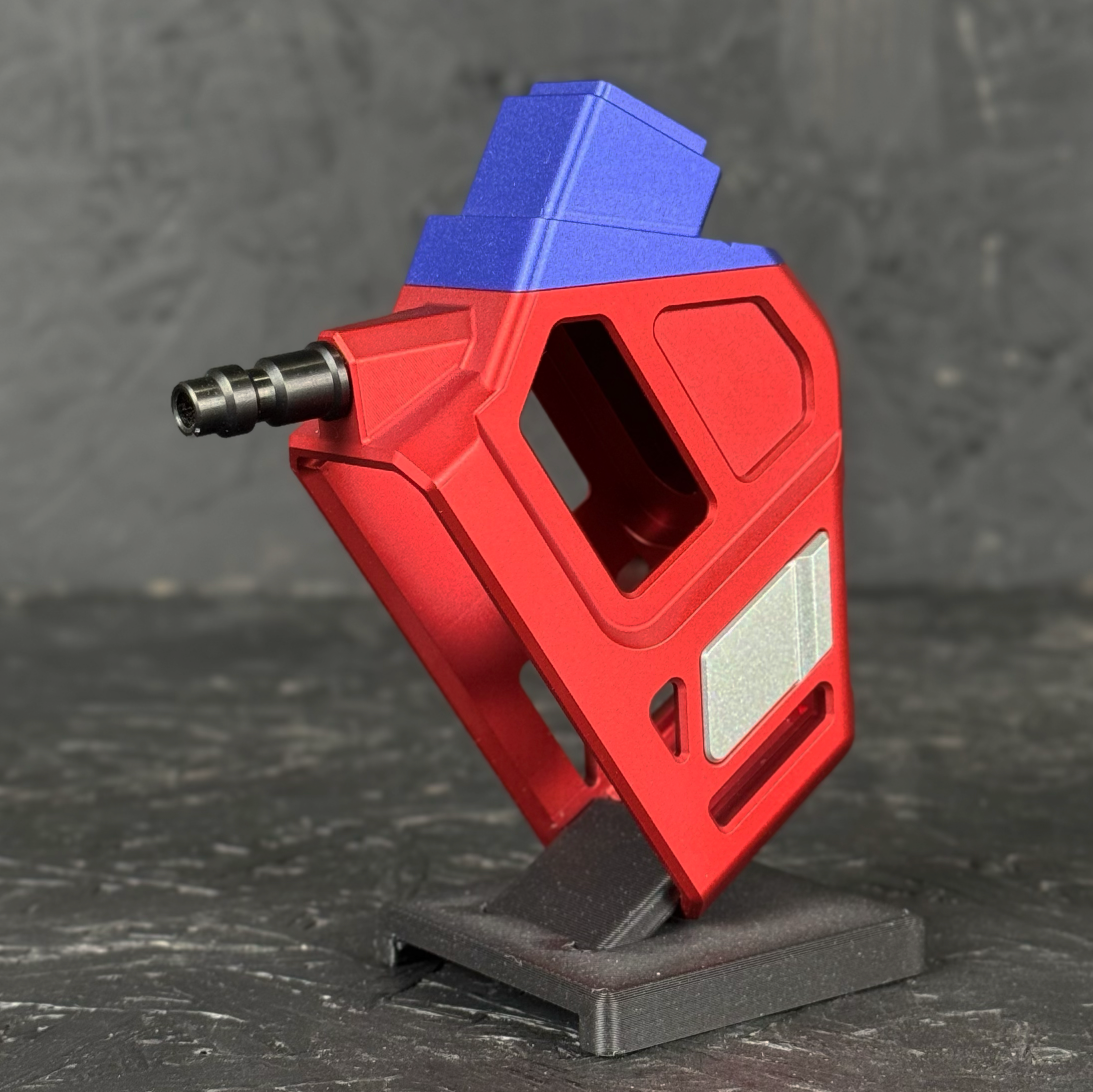 Photo of T1P CNC Angled HPA Adapter - GLK / AAP - Blue top, red base, silver catch