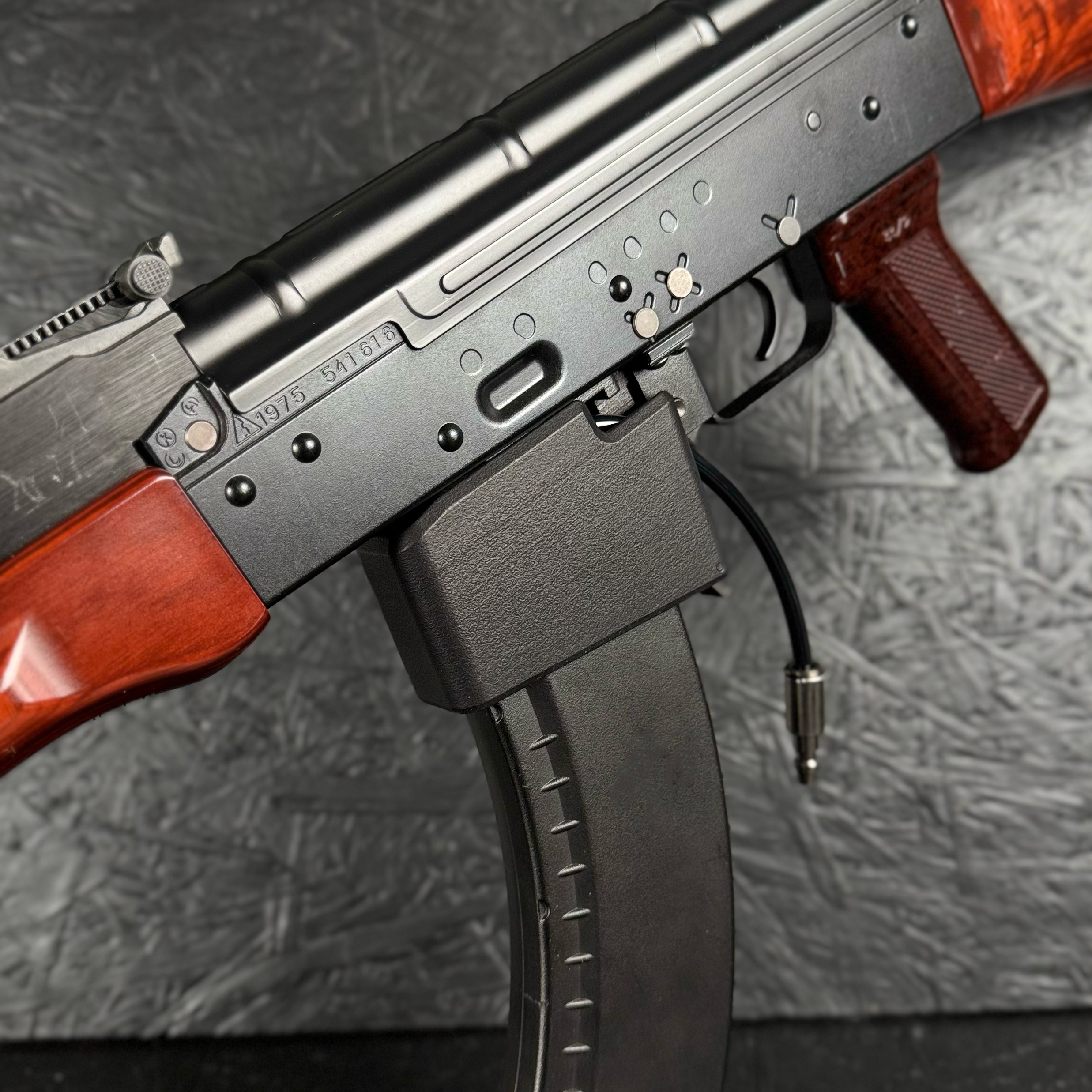 Photo of AIRTAC TM AKM / AKX to AK AEG HPA Adapter in RIF with magazine